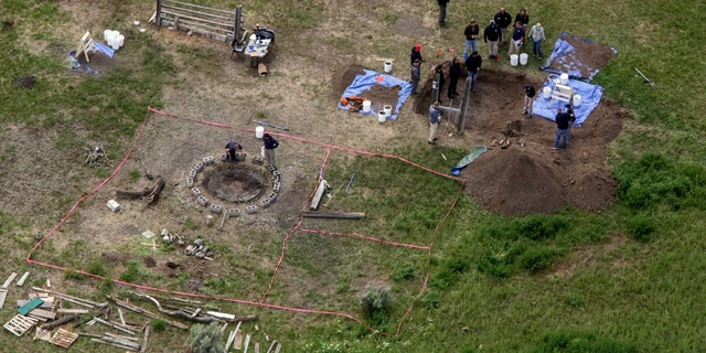 In this aerial photo, investigators search for human remains at Chad Daybell's residence in Salem, Idaho, on June 9, 2020. A mother charged with murder in the deaths of her two children is set to stand trial in Idaho. The proceedings against Lori Vallow Daybell, the wife of Chad Daybell, beginning Monday, April 3, 2023, could reveal new details in the strange, doomsday-focused case.