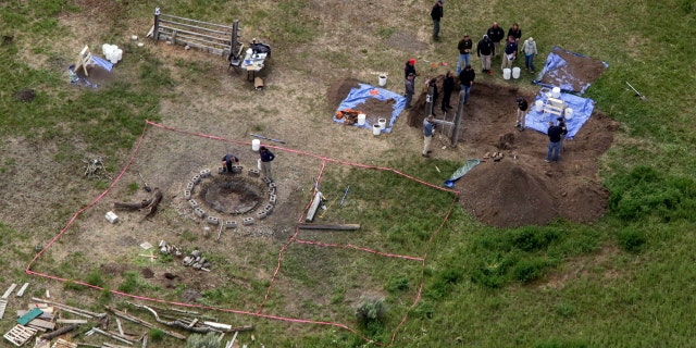 In this aerial photo, investigators search for human remains at Chad Daybell's residence in Salem, Idaho, on June 9, 2020. A mother charged with murder in the deaths of her two children is set to stand trial in Idaho. The proceedings against Lori Vallow Daybell, the wife of Chad Daybell, beginning Monday, April 3, 2023, could reveal new details in the strange, doomsday-focused case.