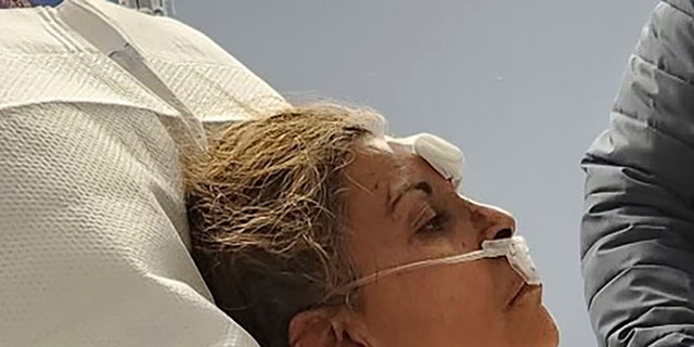 This photo provided by Aaron Paz shows Patricia Borges at Reading Hospital in West Reading, Pennsylvania, on March 25, 2023.  Borges was pulled alive from the rubble of the R.M. Palmer Co. chocolate factory.
