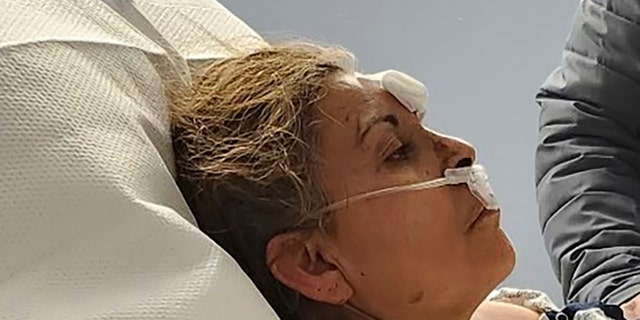 This photo provided by Aaron Paz shows Patricia Borges at Reading Hospital in West Reading, Pennsylvania, on March 25, 2023.  Borges was pulled alive from the rubble of the R.M. Palmer Co. chocolate factory.