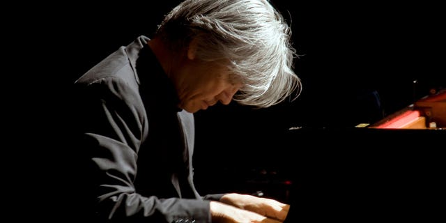 FILE - Maestro Ryuichi Sakamoto performs at Rome's Auditorium, Wednesday, Oct. 28, 2009.  Japan's recording company Avex says Sakamoto, a musician who scored for Hollywood movies such as "The Last Emperor" and "The Revenant," has died. He was 71. He died March 28, according to the statement released Sunday, April 2, 2023.