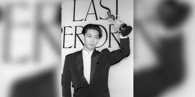 Ryuichi Sakamoto holds the trophy after he won the Academy composition award for "The Last Emperor" in Tokyo, Japan, April, 1988.   Japan's recording company Avex says Sakamoto, a musician who scored for Hollywood movies such as "The Last Emperor" and "The Revenant," has died. He was 71. He died March 28, according to the statement released Sunday, April 2, 2023.