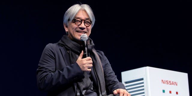 Japanese composer Ryuichi Sakamoto, speaks at the 'Nissan Leaf The New Owner's Meeting' in Tokyo on March 18 2012. Japan's recording company Avex says Sakamoto, a musician who scored for Hollywood movies such as "The Last Emperor" and "The Revenant," has died. He was 71. He died March 28, according to the statement released Sunday, April 2, 2023.