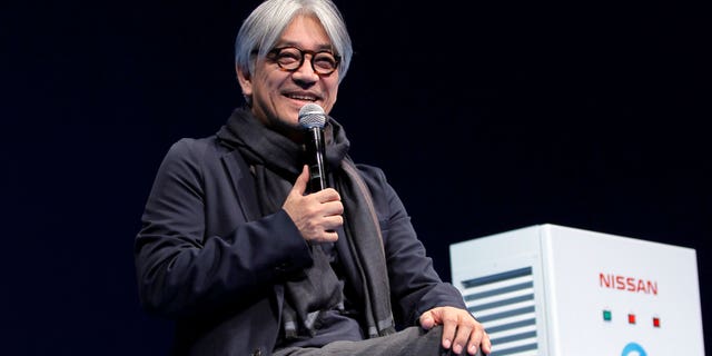 Japanese composer Ryuichi Sakamoto, speaks at the 'Nissan Leaf The New Owner's Meeting' in Tokyo on March 18 2012. Japan's recording company Avex says Sakamoto, a musician who scored for Hollywood movies such as "The Last Emperor" and "The Revenant," has died. He was 71. He died March 28, according to the statement released Sunday, April 2, 2023.