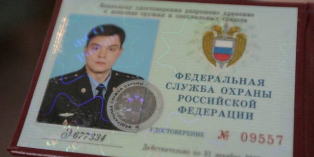 This photo provided by the Dossier Center shows the Russian Federal Protective Service identification card of Gleb Karakulov, in October 2022 in Turkey.