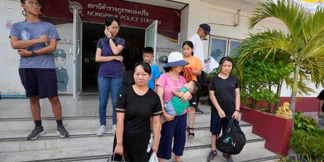 Members of the Shenzhen Holy Reformed Church leave from the Nongprue police station on their way to Pattaya Provincial Court in Pattaya, Thailand, on March 31, 2023.