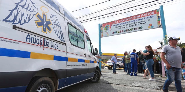 An ambulance is parked outside the private day care center Cantinho do Bom Pastor after the attack in Blumenau, Brazil.