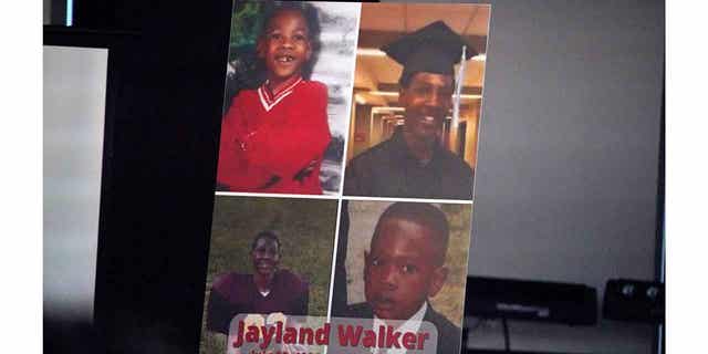 A poster on the stage during a news conference following the funeral service for Jayland Walker at the Akron Civic Center in Akron, Ohio, July 13, 2022.