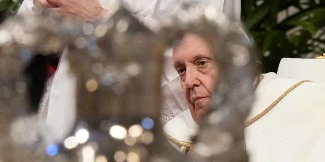 Pope Francis blesses chrism oil during a Mass inside St. Peters Basilica, at the Vatican on Holy Thursday, April 6, 2023.