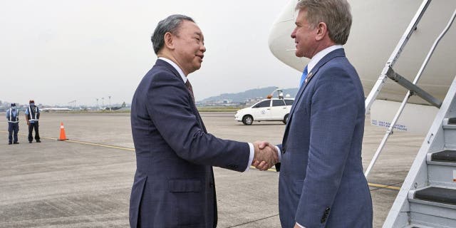 In this photo released by the Taiwan Presidential Office, Michael McCaul, chairman of the Foreign Affairs Committee in the United States House of Representatives, right, is welcomed by Taiwan's deputy foreign minister Tah-ray Yui upon arrival in Taipei, Taiwan, Thursday, April 6, 2023.