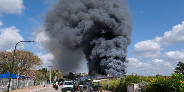 Smoke rises from a fire after rockets fired from Lebanon struck Bezet, northern Israel, Thursday, April 6, 2023. 
