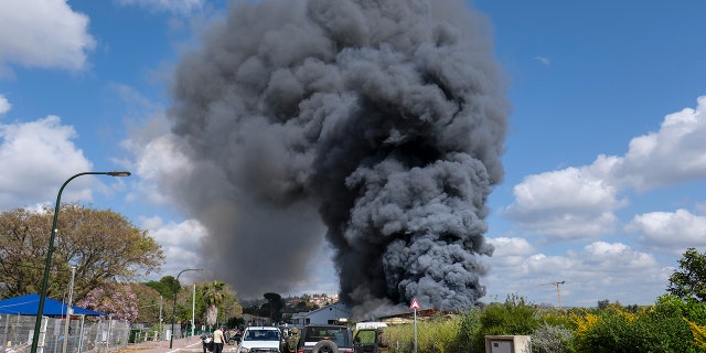 Smoke rises from a fire after rockets fired from Lebanon struck Bezet, northern Israel, Thursday, April 6, 2023. 