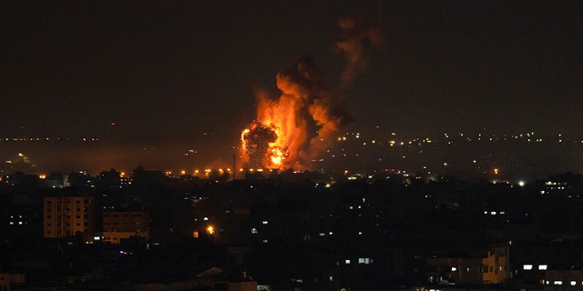 Fire and smoke rise following an Israeli airstrike in central Gaza Strip, Friday, April 7, 2023. 