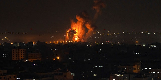 Fire and smoke rise following an Israeli airstrike in central Gaza Strip, Friday, April 7, 2023.