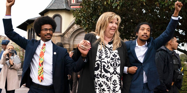Tennessee Democrat Reps. Justin Pearson, Gloria Johnson and Justin Jones are shown raising their fists as they walk across Fisk University campus after hearing Vice President Kamala Harris speak on April 7, 2023, in Nashville.