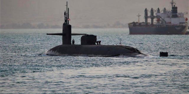 This photo released by the U.S. Navy show a guided-missile submarine capable of carrying up to 154 Tomahawk missiles. The Navy said nuclear-powered submarine, based out of Kings Bay, Georgia, passed through the Suez Canal on Friday, April 7, 2023.