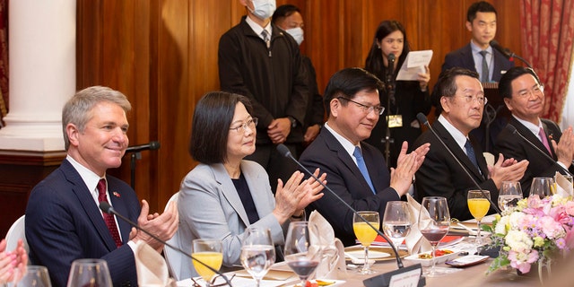 In this photo released by the Taiwan Presidential Office, House Foreign Affairs Committee Chairman Michael McCaul, R-Texas, left, and Taiwan's President Tsai Ing-wen, second from left, attend a luncheon during a visit by a Congressional delegation to Taiwan in Taipei, Taiwan, Saturday, April 8, 2023. 