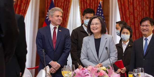 In this photo released by the Taiwan Presidential Office, House Foreign Affairs Committee Chairman Michael McCaul, R-Texas, left, attends a luncheon with Taiwan's President Tsai Ing-wen, during a visit by a Congressional delegation to Taiwan in Taipei, Taiwan, Saturday, April 8, 2023. China sent warships and dozens of fighter jets toward Taiwan on Saturday, the Taiwanese government said, in retaliation for a meeting between the U.S. House of Representatives speaker and the president of the self-ruled island democracy claimed by Beijing as part of its territory. 
