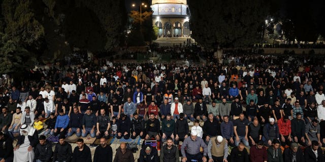 Palestinian worshippers perform "tarawih," an extra lengthy prayer held during the Muslim holy month of Ramadan, next to the Dome of Rock at the Al-Aqsa Mosque compound in the Old City of Jerusalem, Saturday, April 8, 2023.