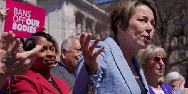 Gov. Maura Healey, front right, faces reporters as Massachusetts AG Andrea Campbell, left, looks on, on April 10, 2023, in Boston. Massachusetts is among the states that are stockpiling doses of mifepristone, according to a statement from Gov. Healey on Monday.