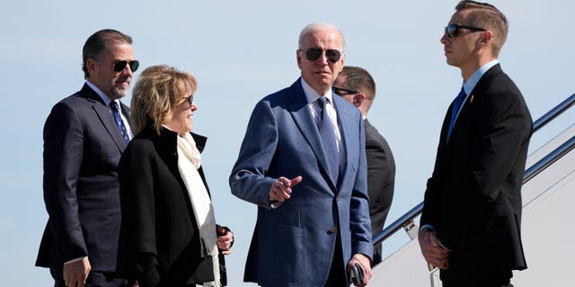 President Joe Biden gestures before he walked over to talk with reporters before boarding Air Force One, Tuesday, April 11, 2023, at Andrews Air Force Base, Md. 