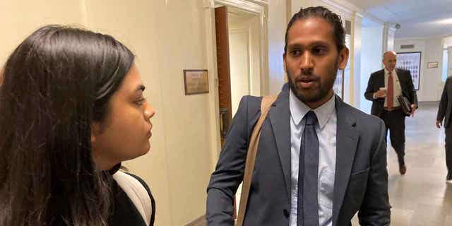 Jay Devineni, right, a student at the University of Missouri, talks with fellow medical school student Supriya Vuda in the hallway of the Missouri Capitol in Jefferson City, on March 28, 2023. Devineni and Vuda testified against legislation that would restrict diversity, equity, and inclusion initiatives in medical schools.