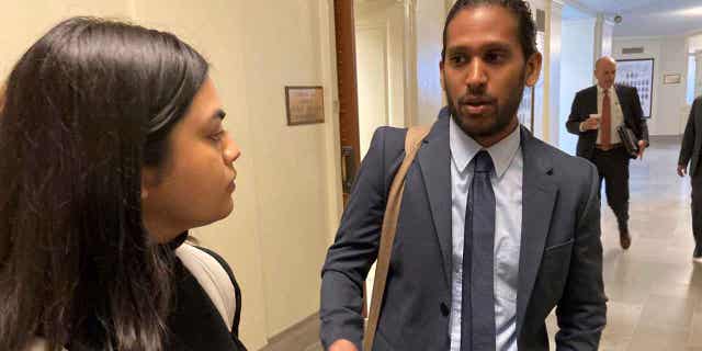 Jay Devineni, right, a student at the University of Missouri, talks with fellow medical school student Supriya Vuda in the hallway of the Missouri Capitol in Jefferson City, on March 28, 2023. Devineni and Vuda testified against legislation that would restrict diversity, equity, and inclusion initiatives in medical schools.