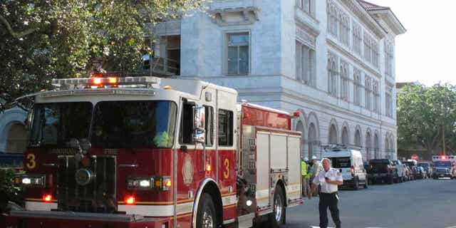 A firetruck sits outside the federal courthouse in Savannah, Georgia, on April 11, 2023, after part of an upper floor collapsed and injured three construction workers. 
