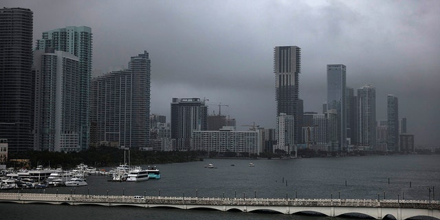 A haze sets over the city during a rainstorm, Wednesday, April 12, 2023, in Miami. 