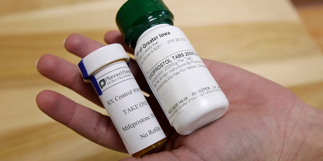 FILE: Bottles of abortion pills mifepristone, left, and misoprostol, right, at a clinic in Des Moines, Iowa. 