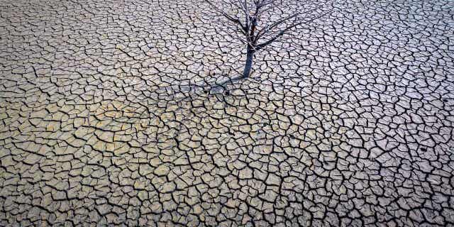 A view of the dry Sau reservoir about 62 miles north of Barcelona. Spain, is shown on March 20, 2023. Farmers in the country fear the long-term drought has led to irreversible damages to crops.