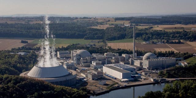 FILE - Water vapor rises from the cooling tower of nuclear power plant of Neckarwestheim II in Neckarwestheim, Germany, Aug. 22, 2022.