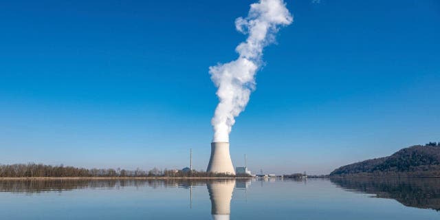 FILE - Water vapor rises from the nuclear power plant Isar II in Essenbach, Germany, March 3, 2022. 