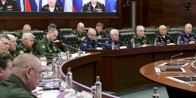 In this handout photo released by Russian Defense Ministry Press Service, Russian high level officers listen to Defense Minister Sergei Shoigu during a meeting in Moscow, Russia, Friday, April 14, 2023.