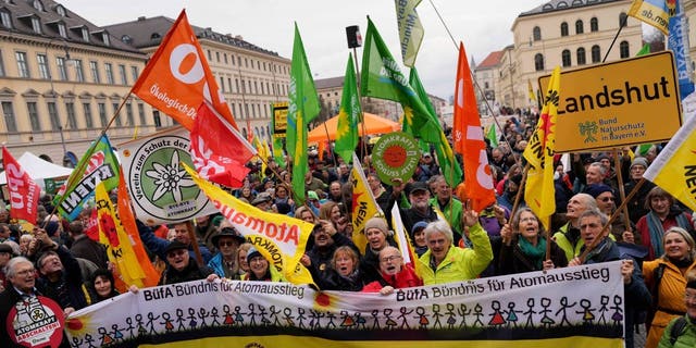 People attend a rally marking the nuclear shutdown in Germany in Munich, Germany, Saturday, April 15, 2023.
