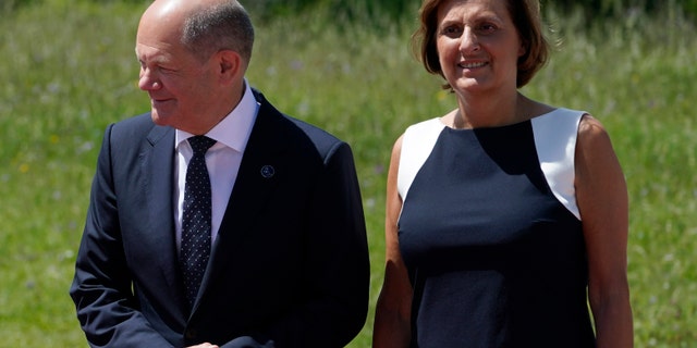 German Chancellor Olaf Scholz, left, and Britta Ernst, the former Brandenburg Minister of Education, attend the G7 Summit in Elmau, Germany, on June 26, 2022, during an arrival ceremony. Britta Ernst is stepping down as the education minister of the region where the couple lives, the government said on April 17, 2023.
