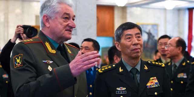 Chief of the Military Academy of the General Staff of the Armed Forces of the Russian Federation Col. Gen. Vladimir Zarudnitsky, left, escorts Chinas Defense Minister Gen. Li Shangfu during a tour in Moscow, Russia, on April 17, 2023.