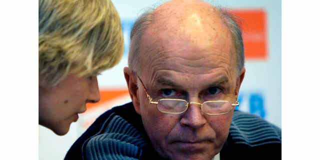 Anders Besseberg, former president of International Biathlon Union, right, listens to then IBU Secretary General Nicole Resch before a press conference in Pyeongchang, South Korea, on Feb. 13, 2009. The former president of the IBU has been indicted in his home country of Norway on bribery accusations.