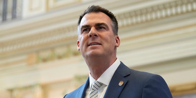 Oklahoma Gov. Kevin Stitt called for the resignations of several county officials after the local newspaper released an audio recording of some of them discussing killing local journalists and hanging Black people.