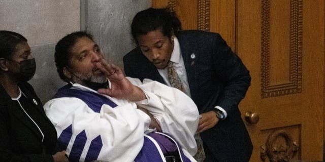 Rev. William J. Barber speaks with Rep. Justin Jones on the floor of the House chamber Monday, April 17, 2023, in Nashville, Tennessee.
