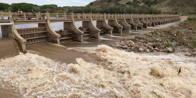 A dam along the Rio Grande is seen near San Acacia, New Mexico, on May 9, 2019. The headwaters of the Rio Grande and the Pecos River recorded some of the best snowfall in years, resulting in spring runoff that will provide a major boost to reservoirs along the rivers.