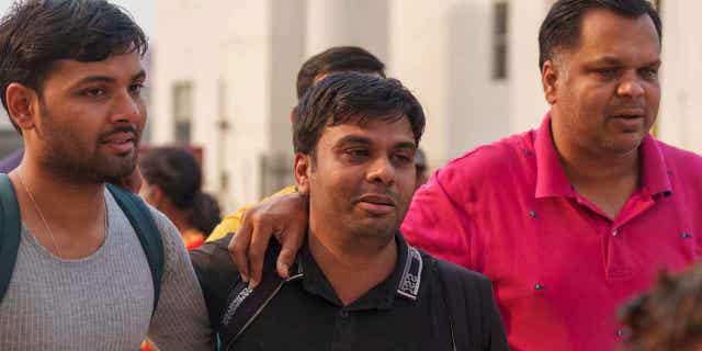 Injured Indian climber with family