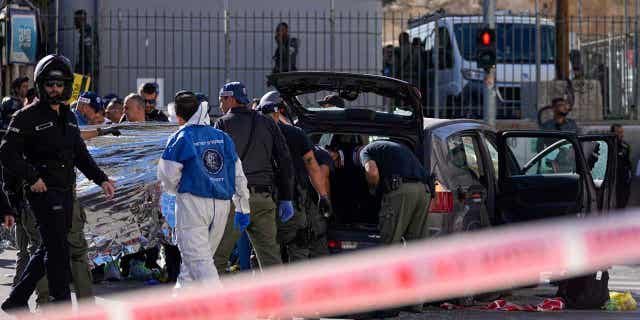 Israeli police examine the scene of a car ramming attack