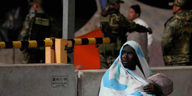 A migrant holds a child