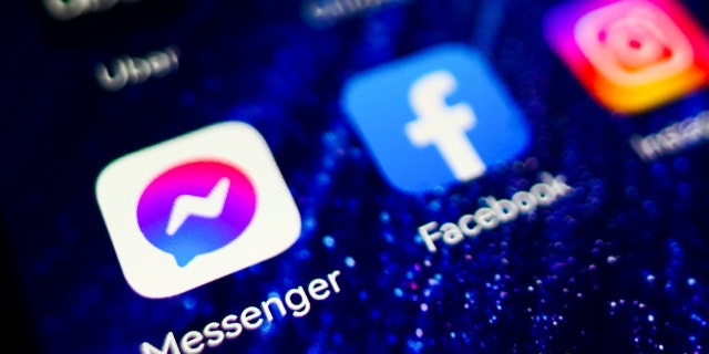 Messenger and Facebook app logos are displayed on a mobile phone screen for illustration photo. Krakow, Poland on January 23, 2023. 