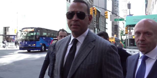 Alex Rodriguez seen walking near Trump Tower ahead of Trump's surrender in indictment case.