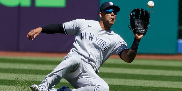 Aaron Hicks #31 of the New York Yankees catches a slider to outfielder Amed Rosario #1 of the Cleveland Cavaliers during the first inning at Progressive Field on April 12, 2023 in Cleveland, Ohio.