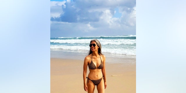 Nina Cash wearing a bikini on the beach