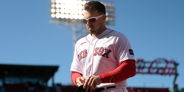 Adam Duvall #18 of the Boston Red Sox looks on during the seventh inning against the Baltimore Orioles at Fenway Park on April 02, 2023 in Boston, Massachusetts.