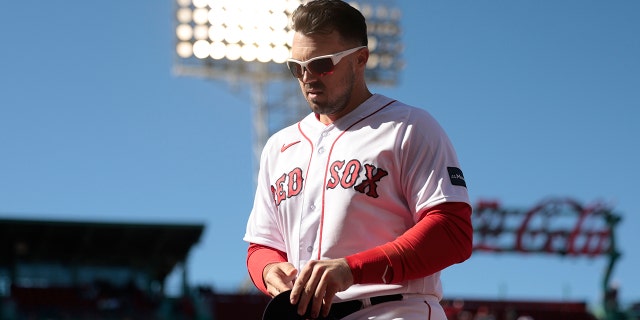 Adam Duvall #18 of the Boston Red Sox looks on during the seventh inning against the Baltimore Orioles at Fenway Park on April 02, 2023 in Boston, Massachusetts.